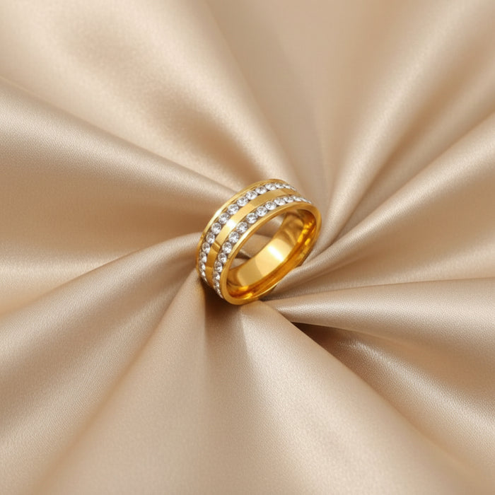 Altin Noor gold-tone stainless steel band ring featuring two rows of sparkling clear cubic zirconia crystals.