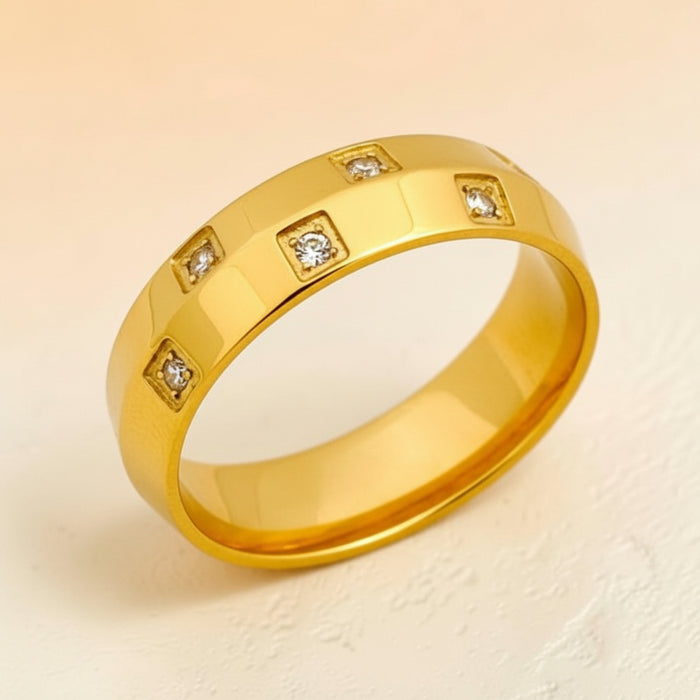 Altin Noor gold plated band ring featuring square-set cubic zirconia stones in a polished minimalist design.