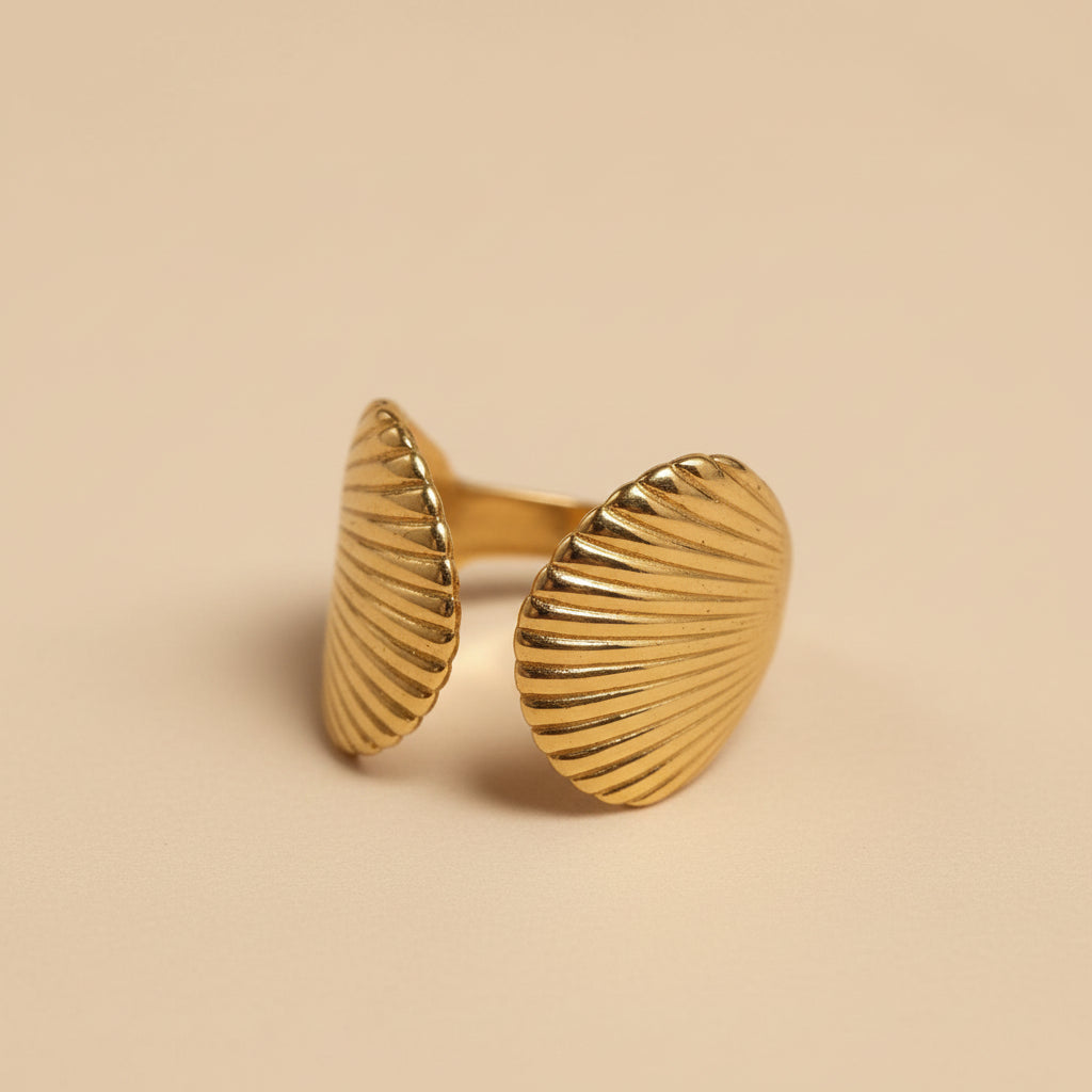 Altin Noor gold-toned open ring featuring two textured fan-shaped shell motifs in a coastal-inspired design.