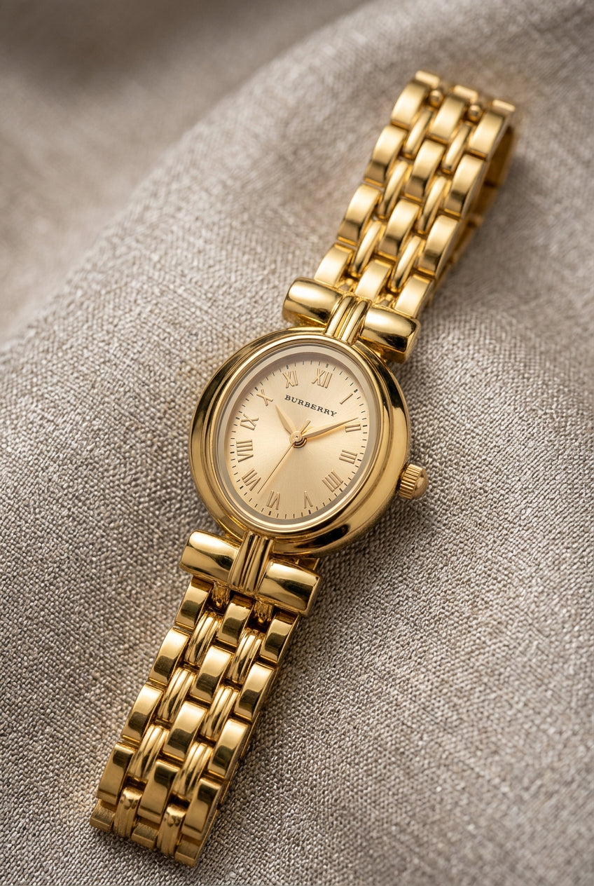 Petite Oval Gold Watch with Champagne Dial
