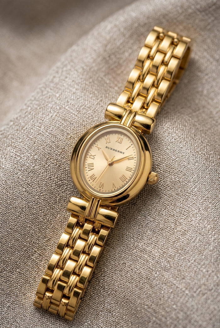 Petite Oval Gold Watch with Champagne Dial